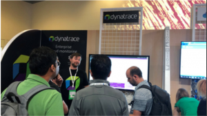 attendees get a demo at the Dynatrace booth